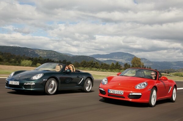 Red and green Porsche in motion