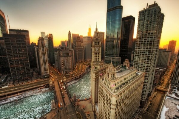 Buildings on the background of the evening sky in the lights of the city