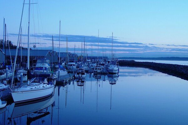 Evening. Yachts. Pier. River