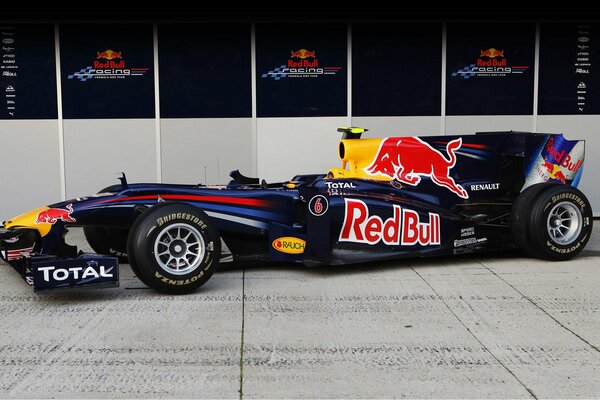 Black racing car with redbull advertising