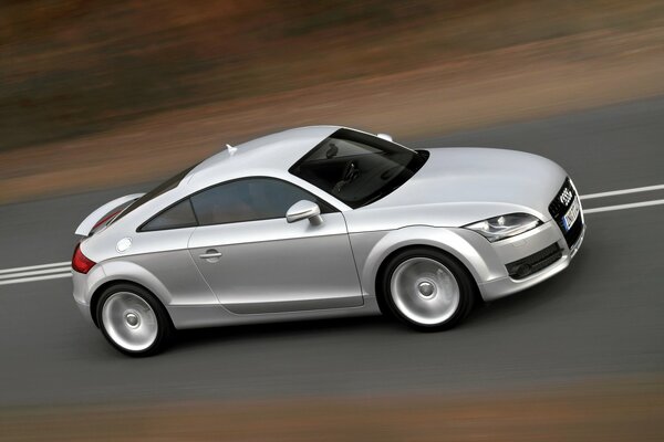 Silver Audi rushes along the highway