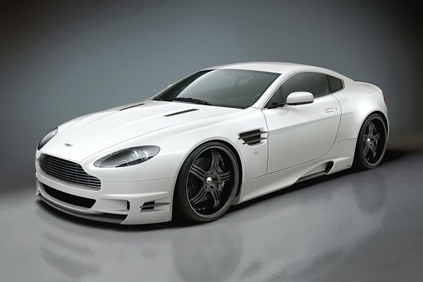 White Aston Martin car with reflection in the floor