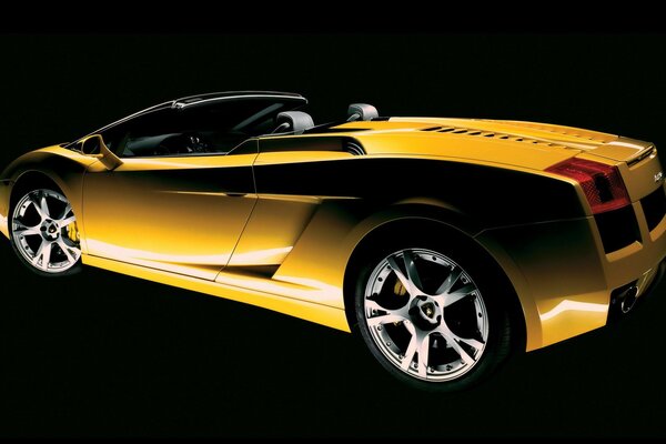 Yellow Lamborghini convertible with silver rims