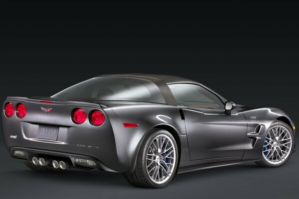 Grey Chevrolet corvette on black background