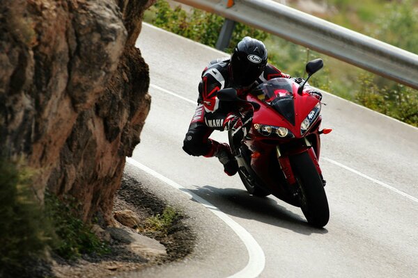 A motorcyclist on a bike enters a turn