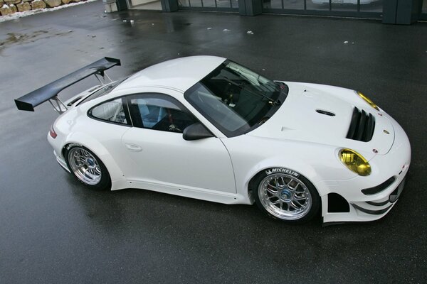 Porsche 911 gt3 rsr sports car on the street in the yard of the house