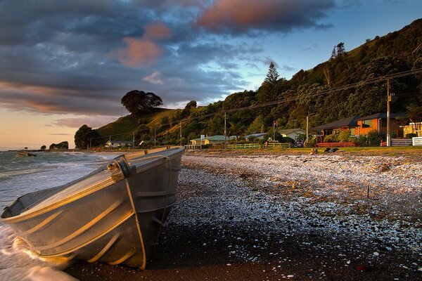 Boat on the background of the seashore