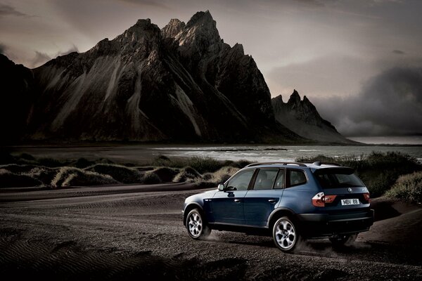 Blue SUV in the Rocky Mountains