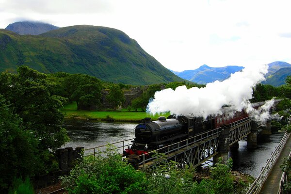 Hogwarts Express on the bridge over the river