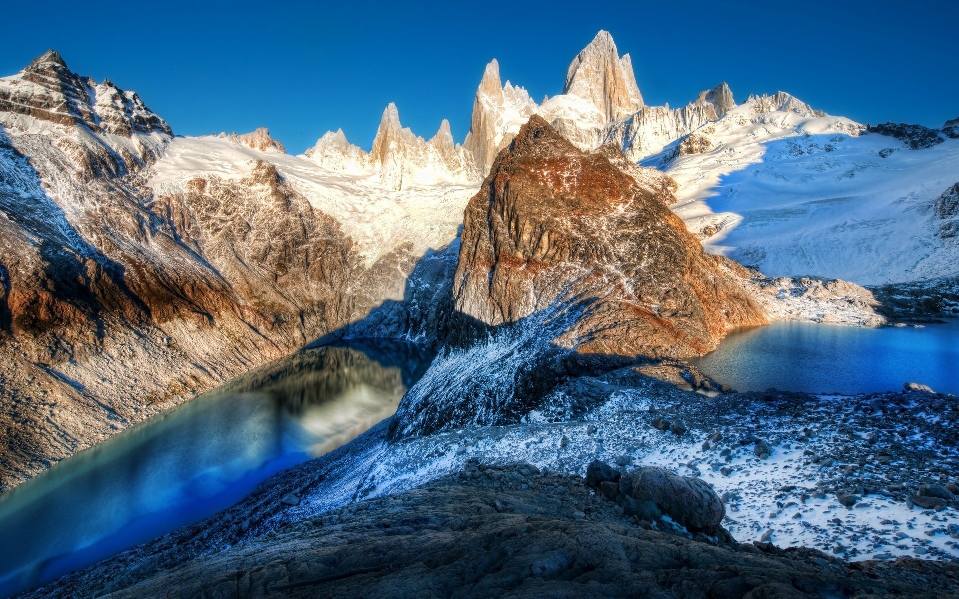 cliff mountain lake from the height winter peak