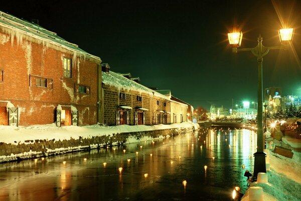 Winter city in the evening light of lanterns