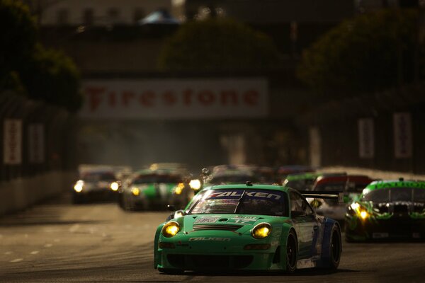 A few green sports cars before the race