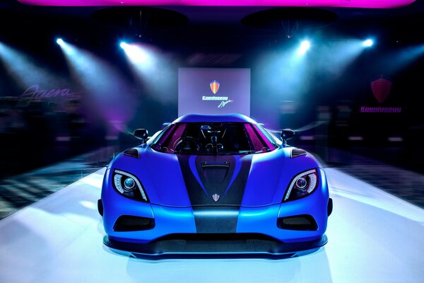 Blue Supercar on the podium, exhibition in Italy