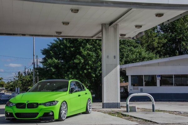 Green BMW with cool headlights