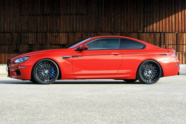 Red coupe car on asphalt