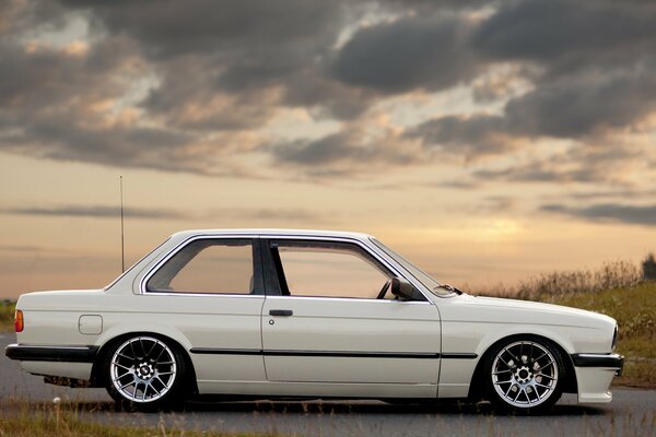 Low car under a gray sky