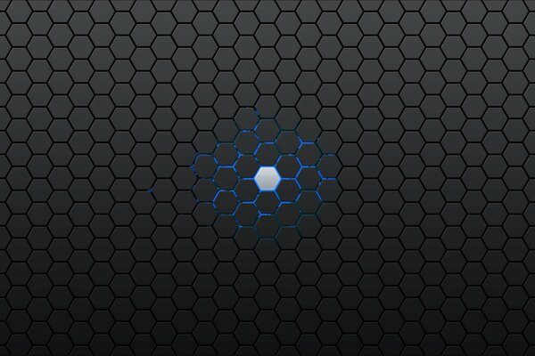 A glowing point of a hexagon on a background of gray honeycombs