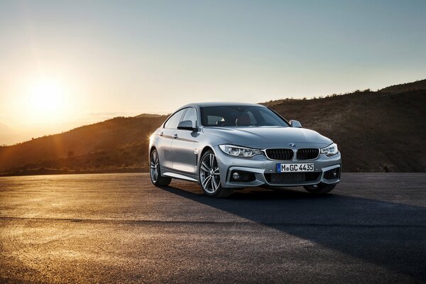 Bmw 4-series on the background of sunset