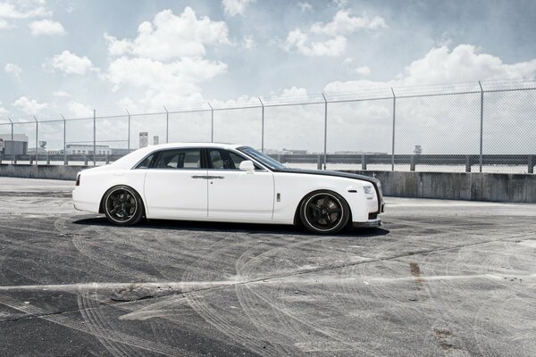 Rolls-royce at the training ground against a cloudy sky