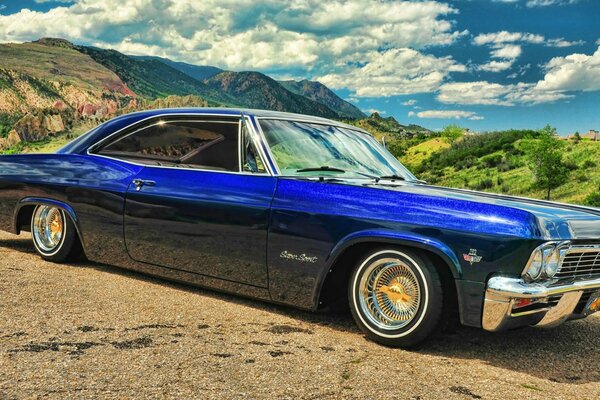 Chevrolet, impala blue on the background of the bay