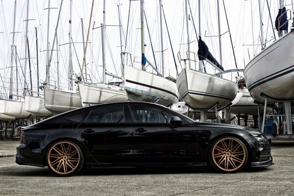 Black car with colored wheels