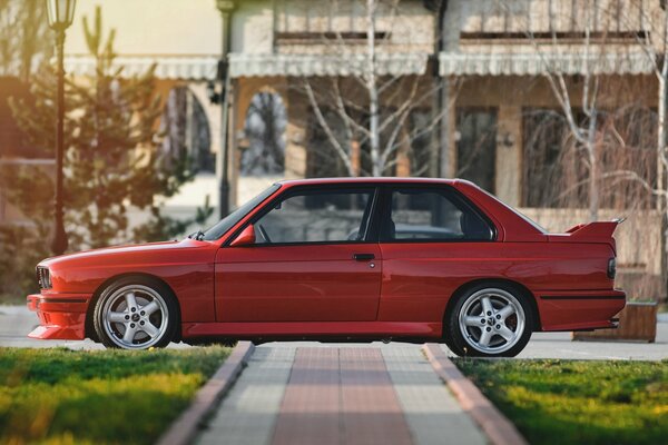 Red BMW on grey discs