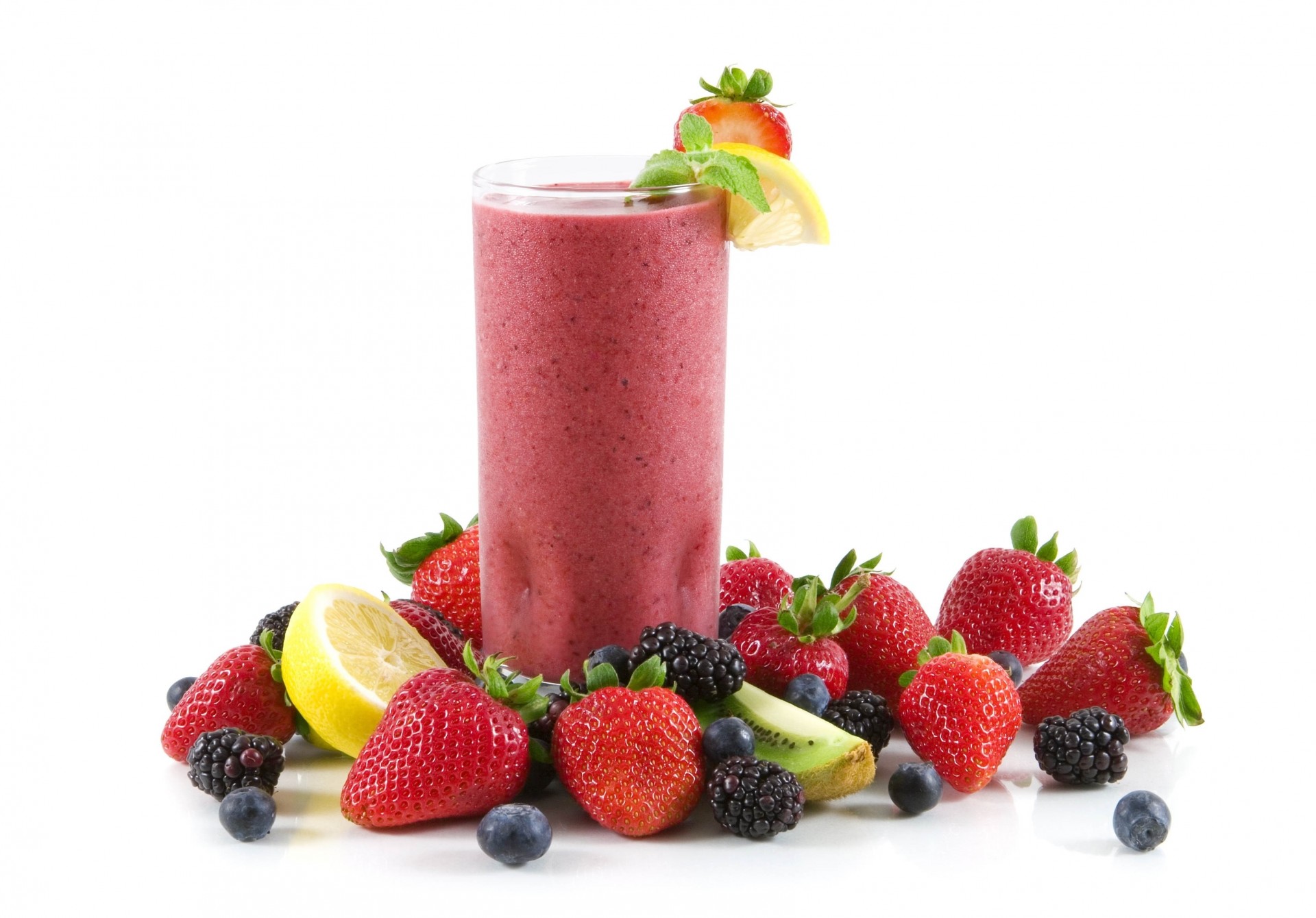 mulberry strawberry blueberries juice white background glass pulp lemon