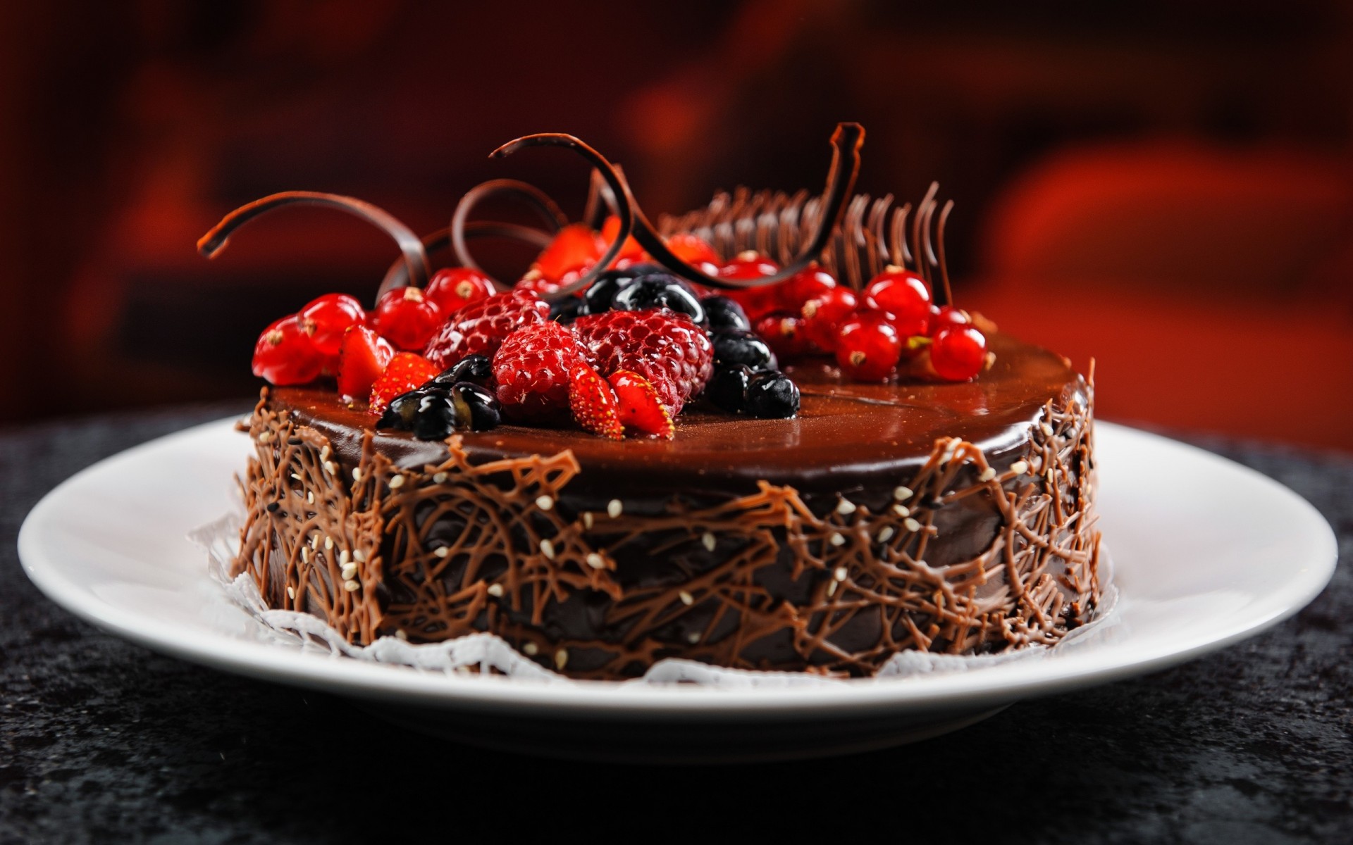 cake raspberry blueberries berries chocolate plate