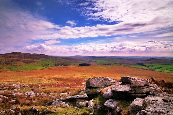 Stone hills in a field with a beautiful sky