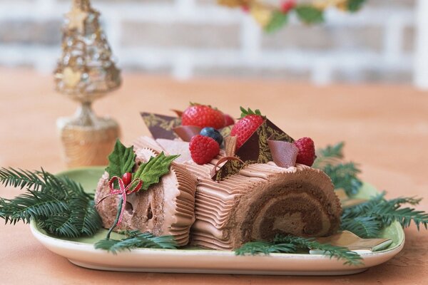 Chocolate roll with berries on a platter