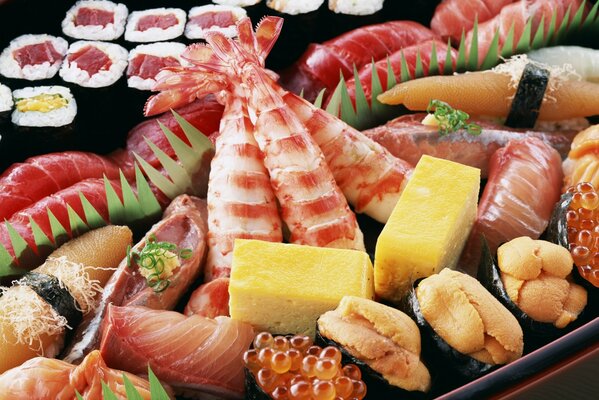 Large plate with seafood, meat and sushi