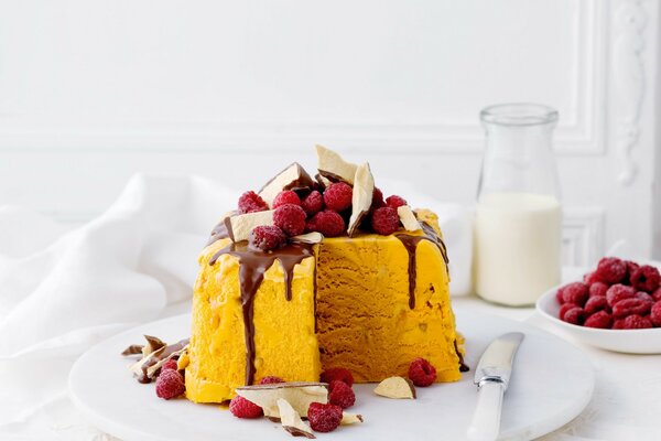 Sweet yellow cake with raspberries