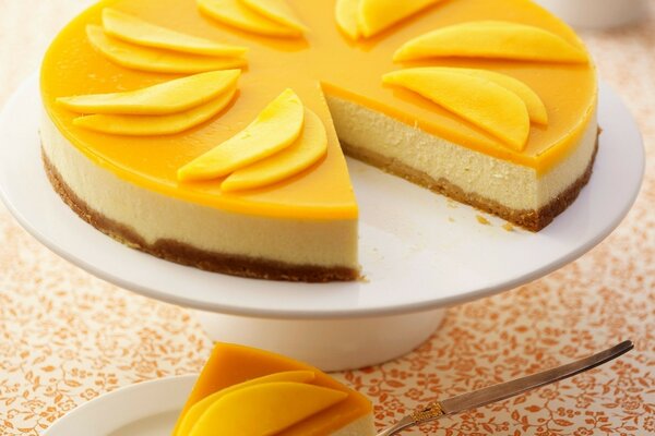 Mango cheesecake on a white plate