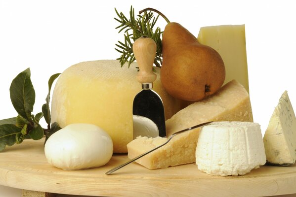 Cheeses decorated with herbs and pears