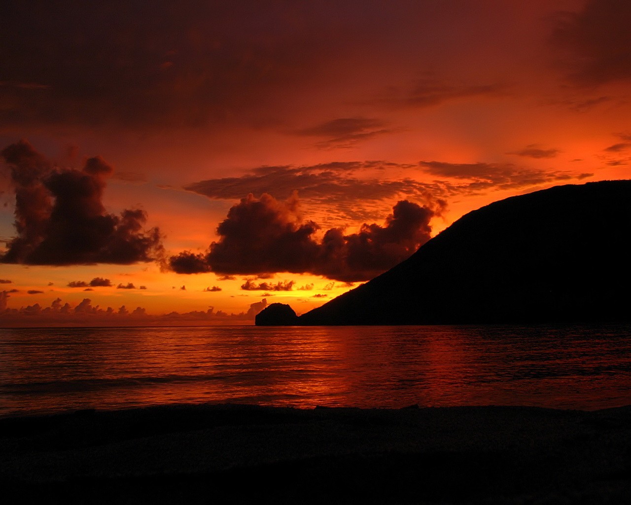 unset beach clouds glow