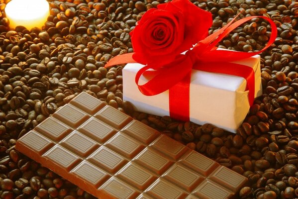 Coffee with chocolate and a gift box in the morning