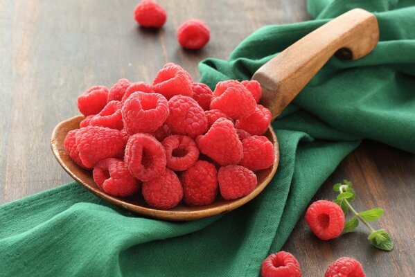 Juicy ripe raspberries on the table