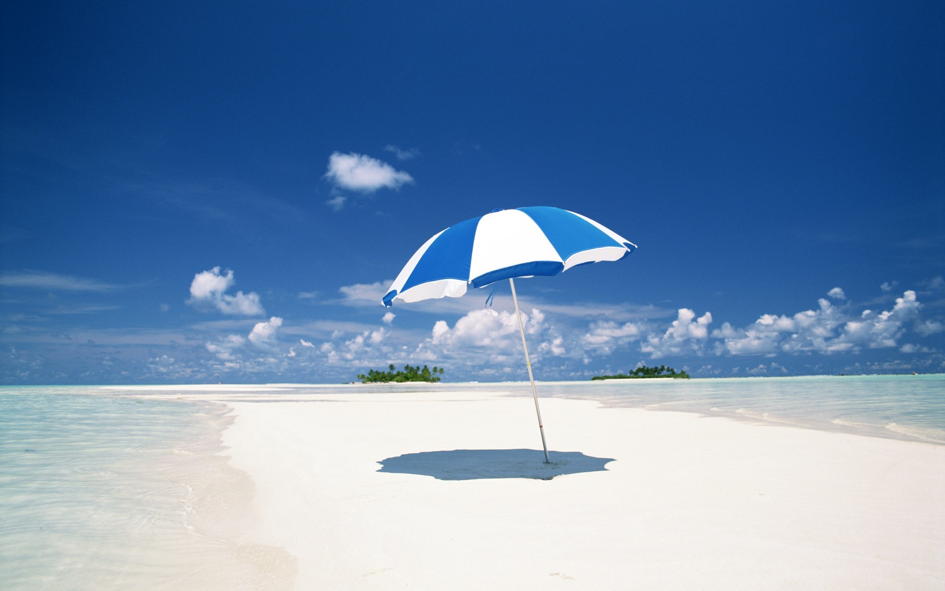 and beach clouds sea umbrella