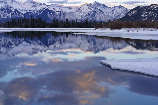 Beautiful lake on the background of winter mountains