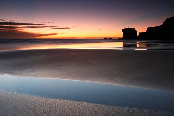 A beautiful sunset is reflected in the water