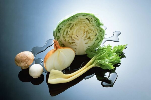 Cabbage and other vegetables on a blue background