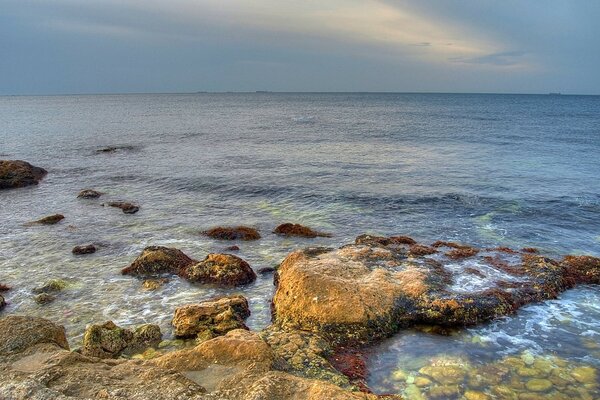 Rocks in the sea , beautiful horizon