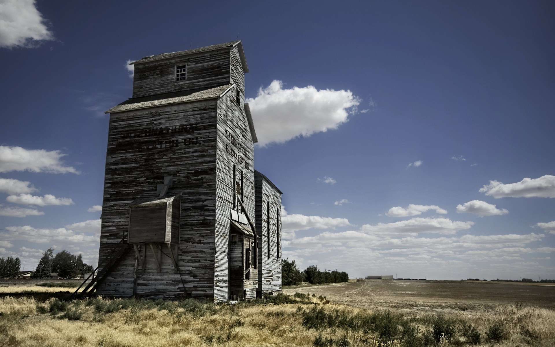 the field clouds building barn