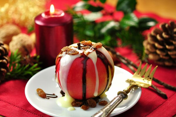 Apple dessert with icing and raisins