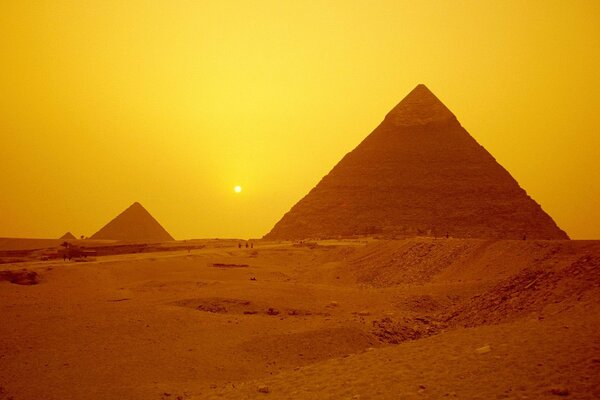 Pyramids of Giza in Egypt in the rays of the departing sun