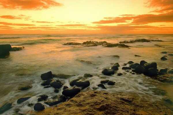 Sunset on the shore of the lake, sunset by the sea