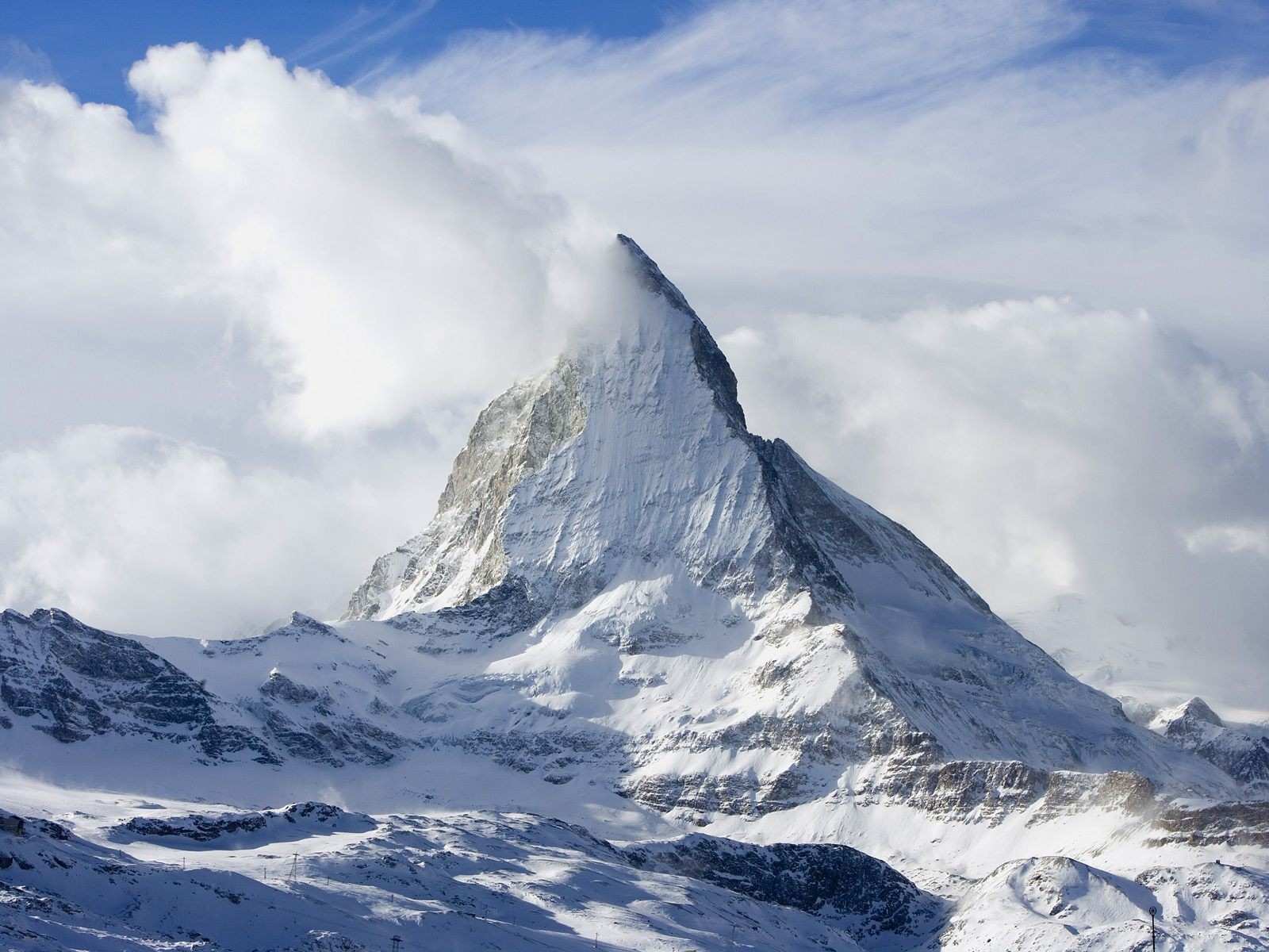 mountain clouds sky snow