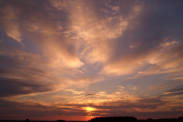 Crimson sunrise and cirrus clouds