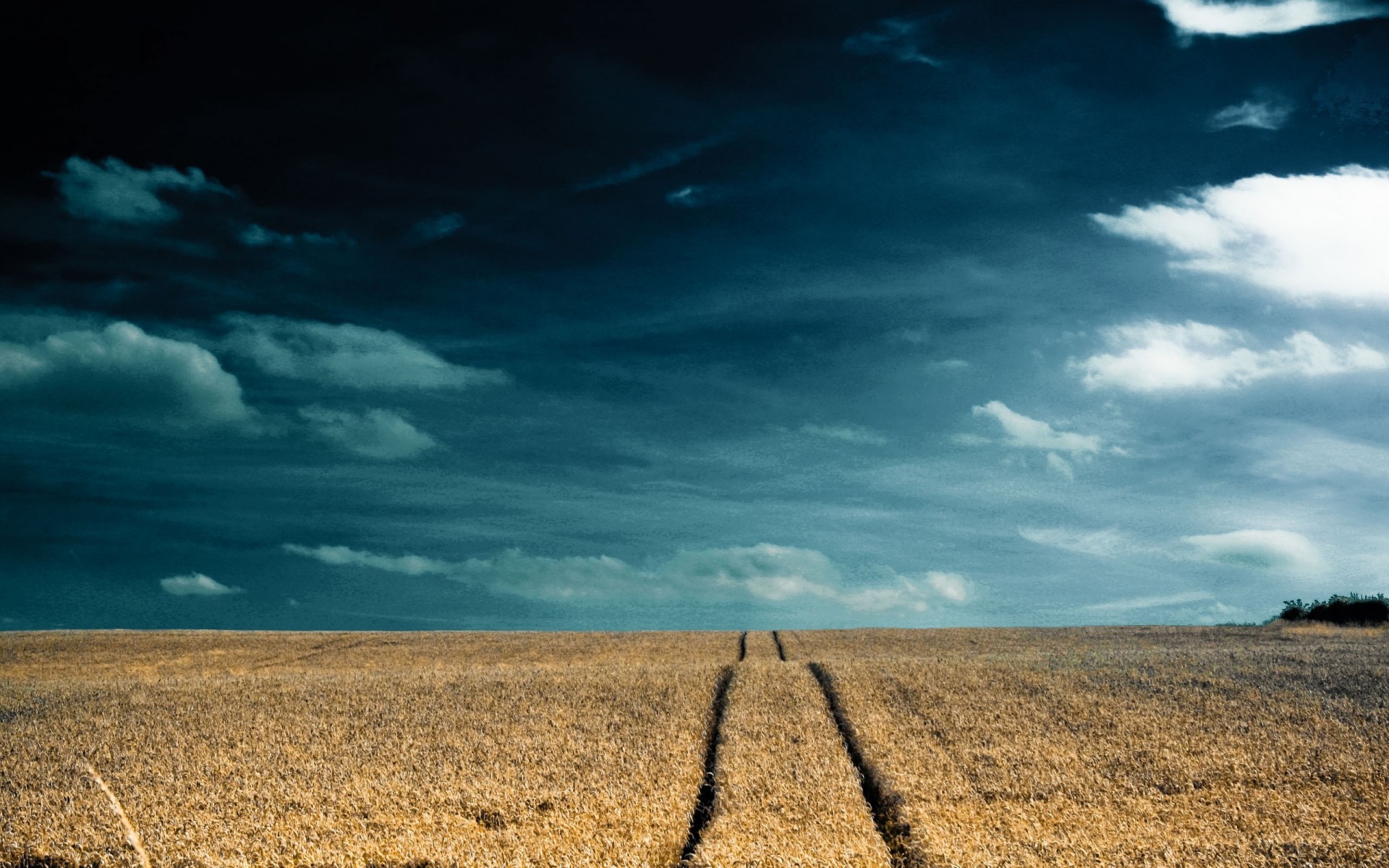 the field sky clouds road