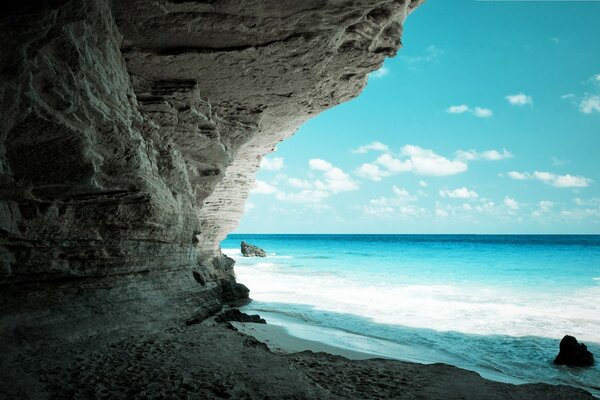 Wild beach in the rocks on the sea